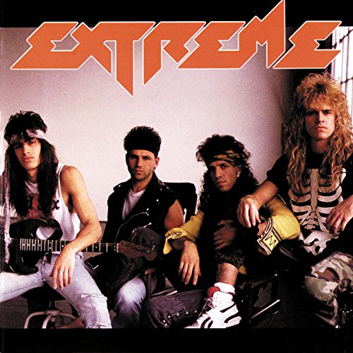 1990s album cover featuring four men with long hair, posing casually.