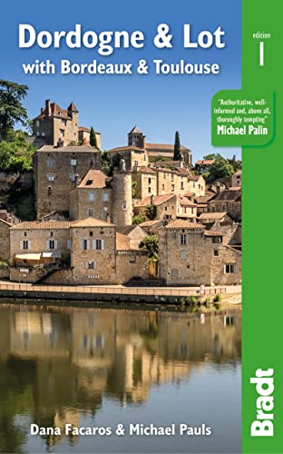 Travel guide cover featuring a medieval town reflected in water.