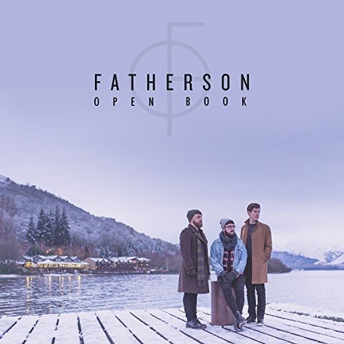 The alt text for the image is: "Three men standing on a snowy dock by a lake."