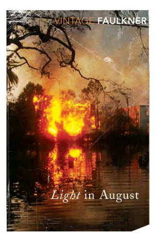 Book cover showing a fiery blaze reflected in water beneath dark tree branches.