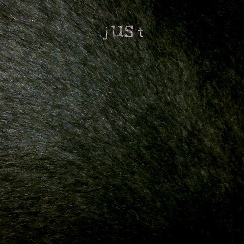A dark grey vinyl record sleeve with the word "just" printed in white.