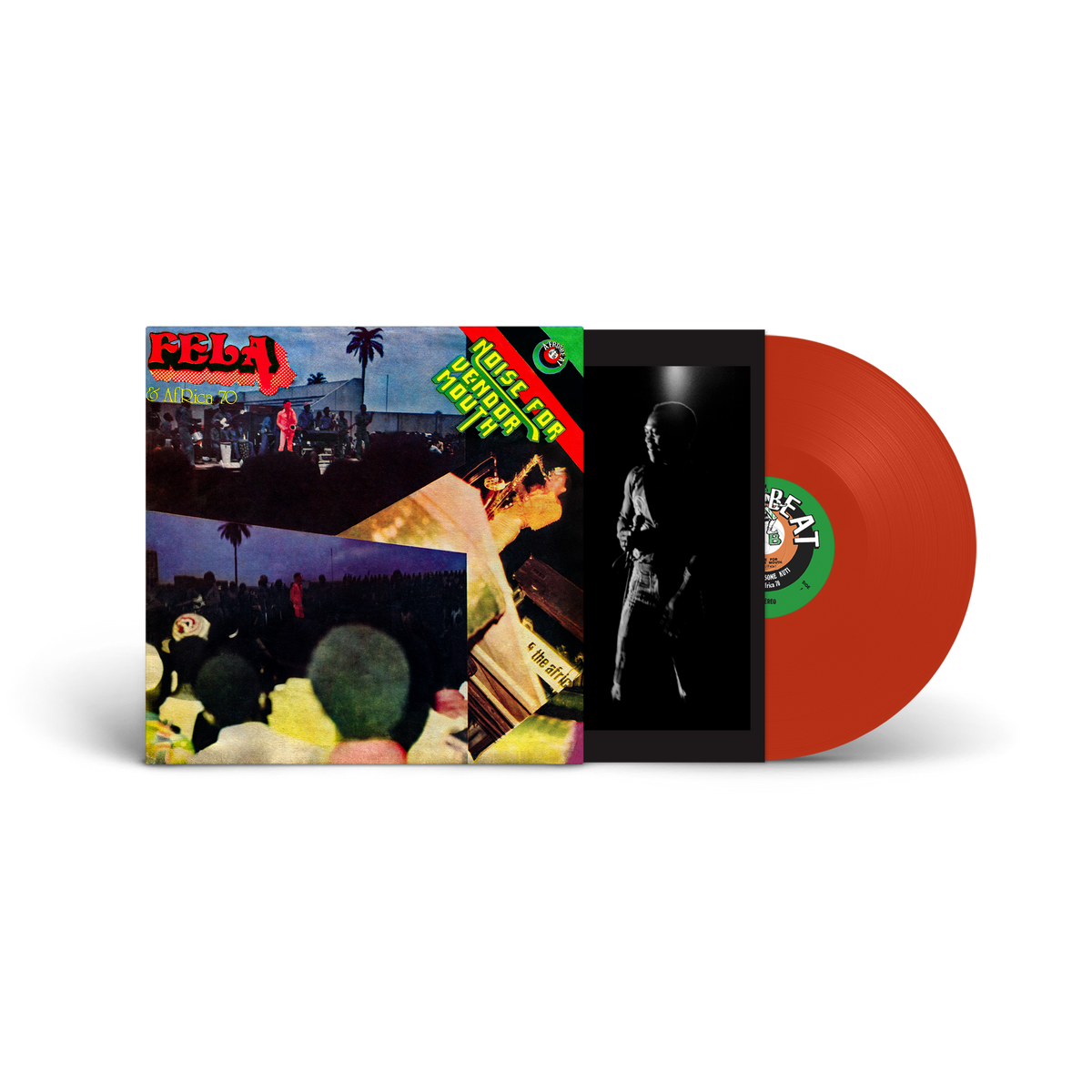 Fela Kuti vinyl record with orange disc and tropical album art.