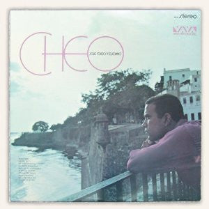 Vinyl record cover featuring Cheo Feliciano and a coastal landscape.