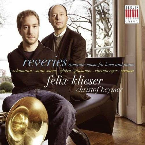 CD cover featuring two men, one holding a French horn, with text overlay.