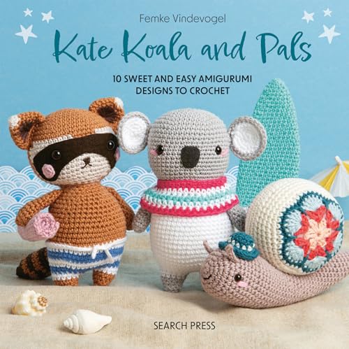 Crocheted koala, raccoon, snail and cactus on a sandy background.
