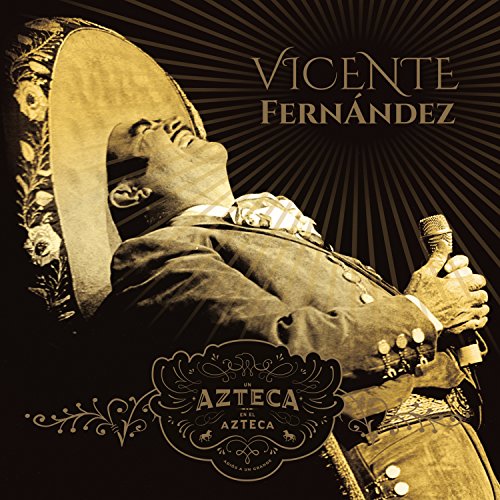 Vicente Fernández in a sombrero, holding a microphone and guitar.