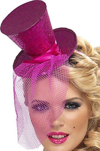 Hot pink mini tophat on a headband with netting veil worn by a blonde woman.