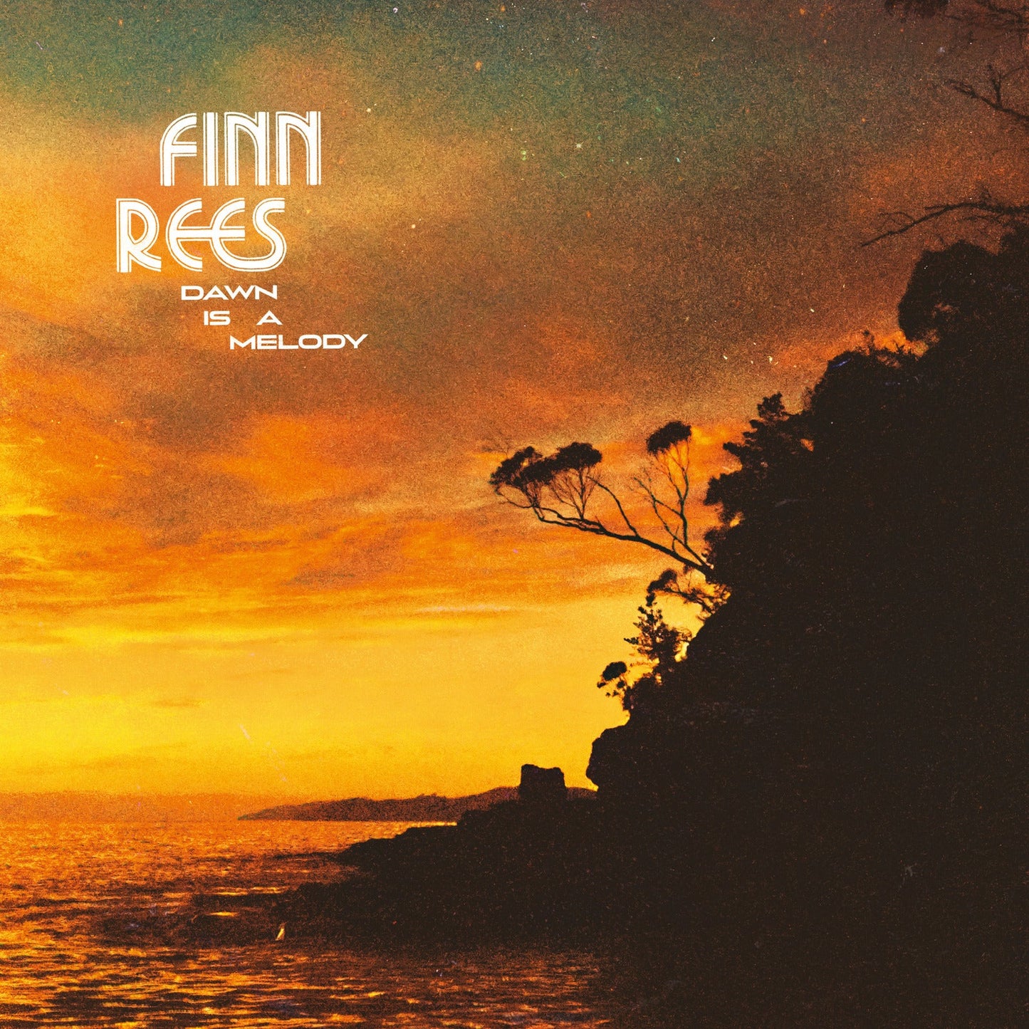 Album cover for Finn Rees’ “Dawn Is A Melody” with a sunset landscape.