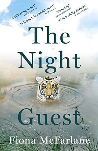 Book cover: "The Night Guest" with a tiger’s face in water.
