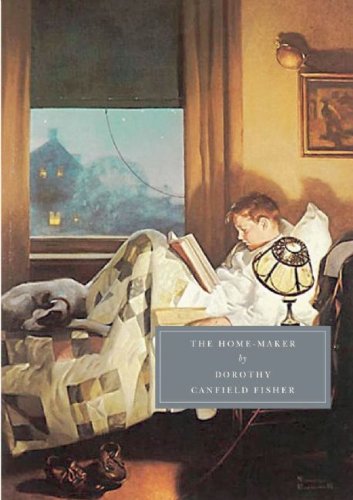A boy reads in bed with a dog under a quilt by a window.