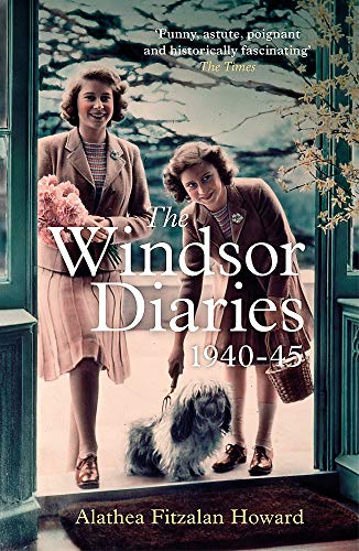 Two young women stand in a doorway with a small dog on a leash.