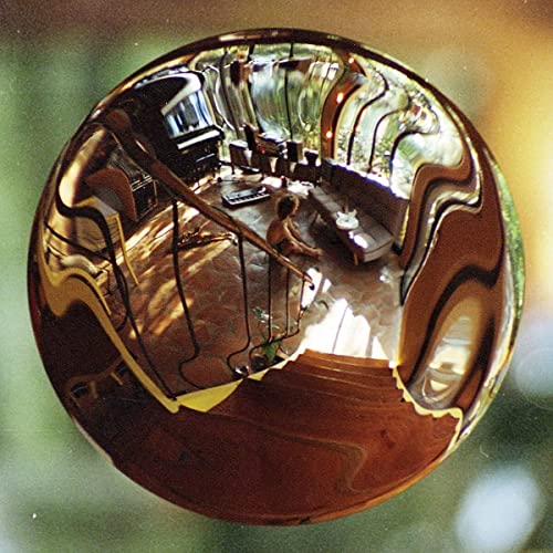 Vinyl record cover with distorted, reflective interior room image.