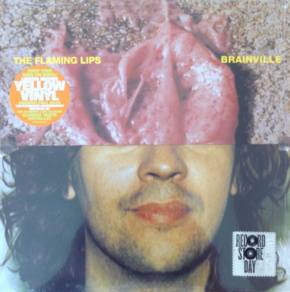 Album cover for The Flaming Lips’ Brainville, featuring fleshy pink imagery.