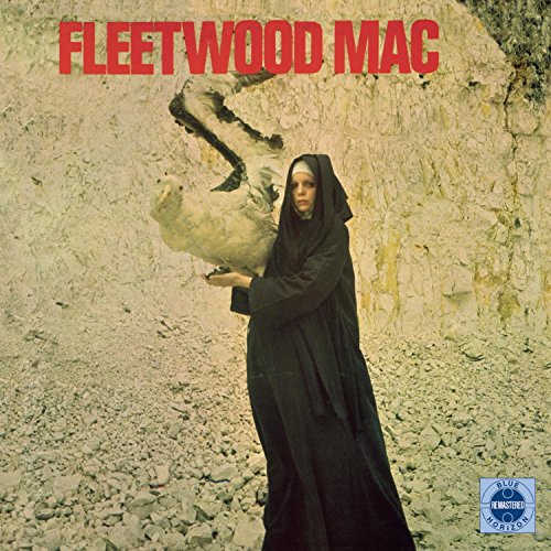 Fleetwood Mac album cover: woman in black veil with white birds.