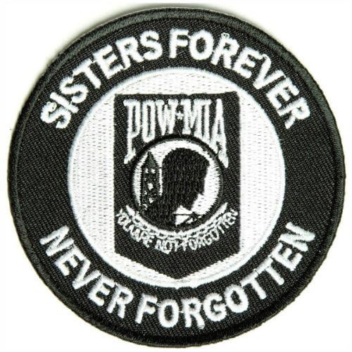 Black and white circular patch with POW/MIA silhouette and text.