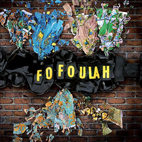 The image shows a vinyl record cover with the title "FOFOULAH". The alt text is: "Vinyl record cover with 'FOFOULAH' in yellow on a brick wall."