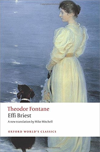 A woman in a yellow dress and a dog stand by the water.