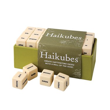 Green box of Haikubes with scattered lettered dice on a white background.