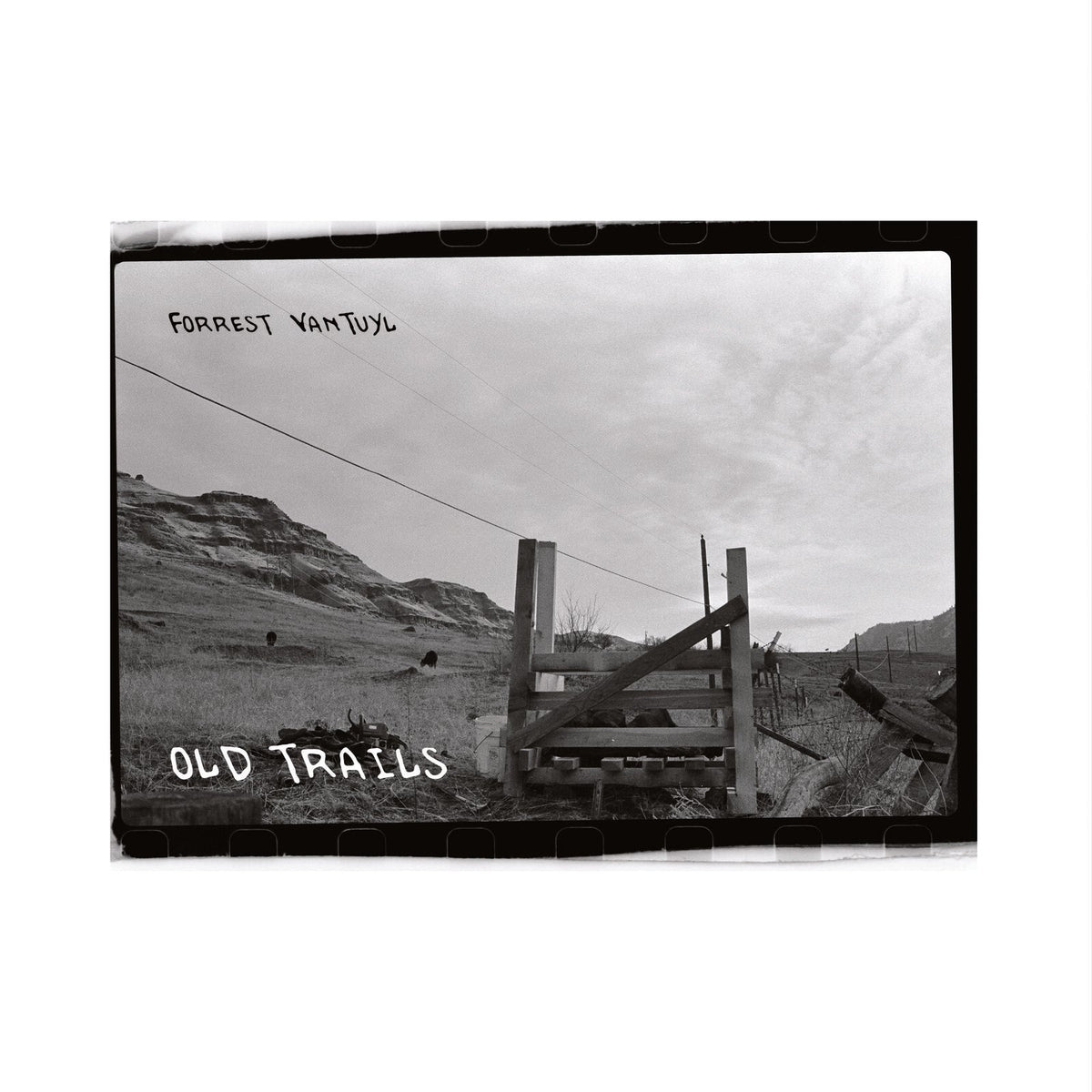 Black and white CD cover with a landscape, fence, and text.