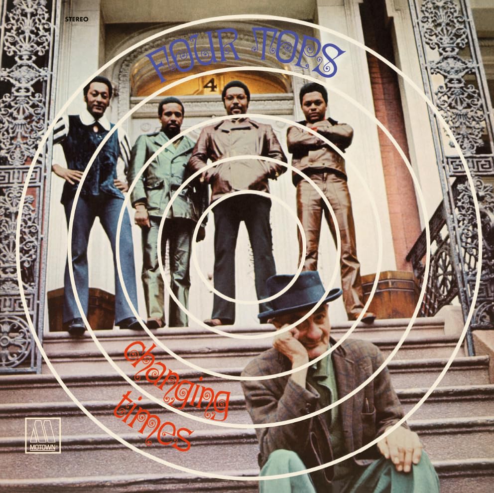 Four Tops "Changing Times" vinyl album cover with group photo and swirling design.