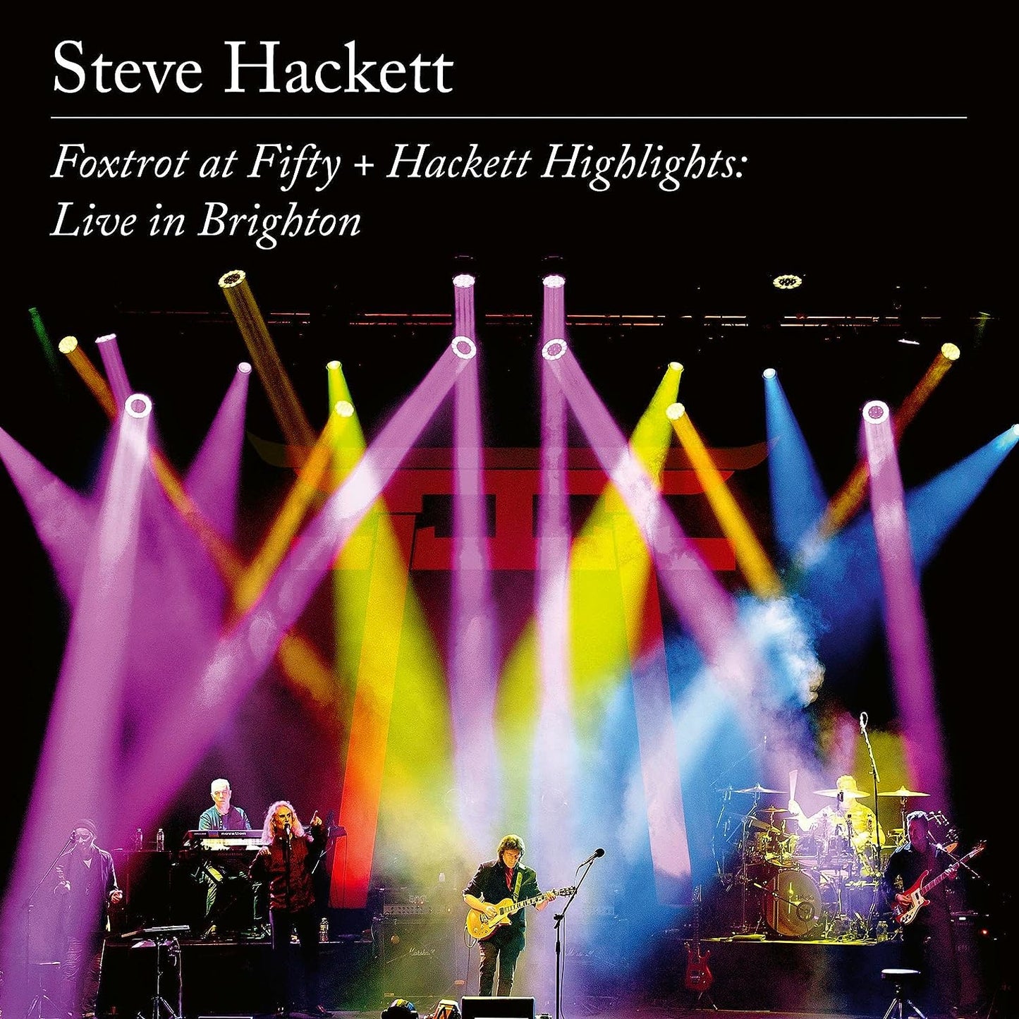 Steve Hackett concert album cover with stage lights and band performing.