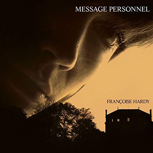 Vinyl album cover featuring a close-up of a woman's face with a building below.