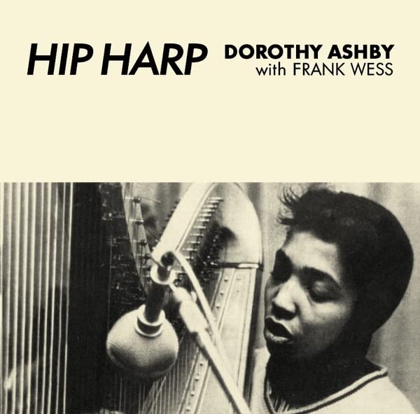 Black and white album cover featuring a harpist and microphone.