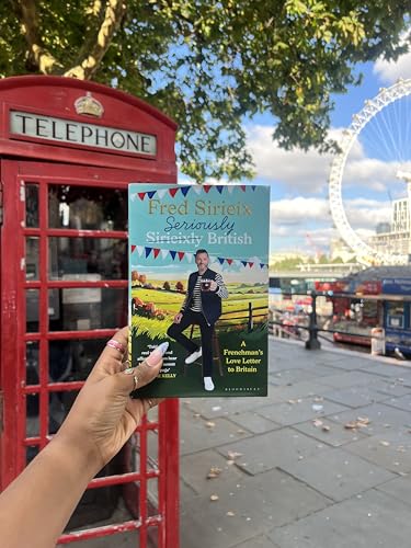 Book cover held near a red phone box, London Eye in background.