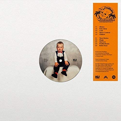 Vinyl record with a baby portrait in the center hole and orange label.