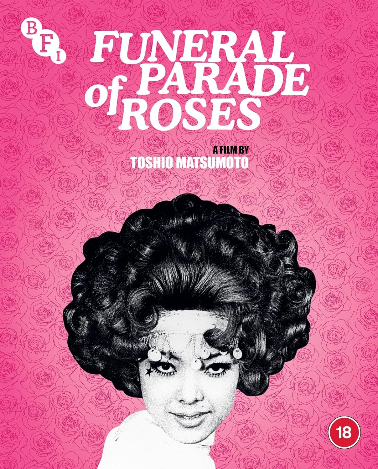 Blu-ray cover art featuring a stylized portrait of a person against pink rose patterns.