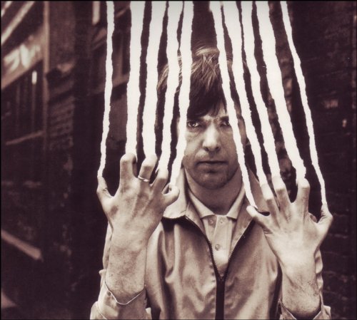 Peter Gabriel portrait with torn paper strands obscuring his face.