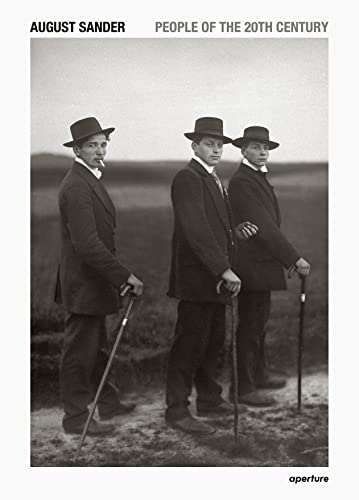 Book cover: black and white portrait of three men in hats and suits.