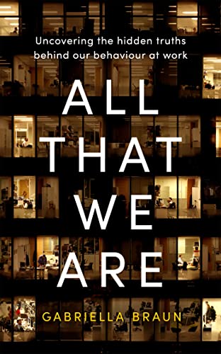 Book cover with illuminated office windows and large white text.