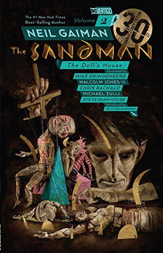 "The Sandman Volume 2" comic book cover featuring marionettes and a large face.