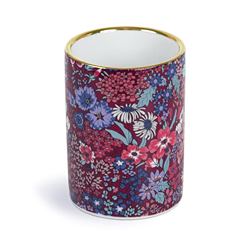 Cylindrical porcelain pen pot with red and blue floral pattern, gold rim.