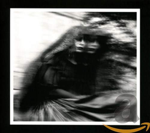 Black and white CD cover with blurred image of a veiled figure.