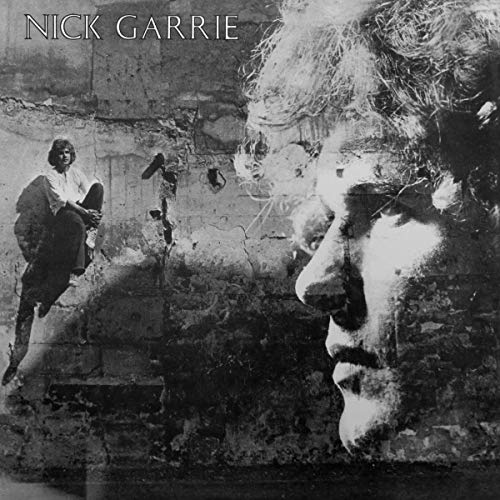 Black and white album cover with a man's face and a man sitting.