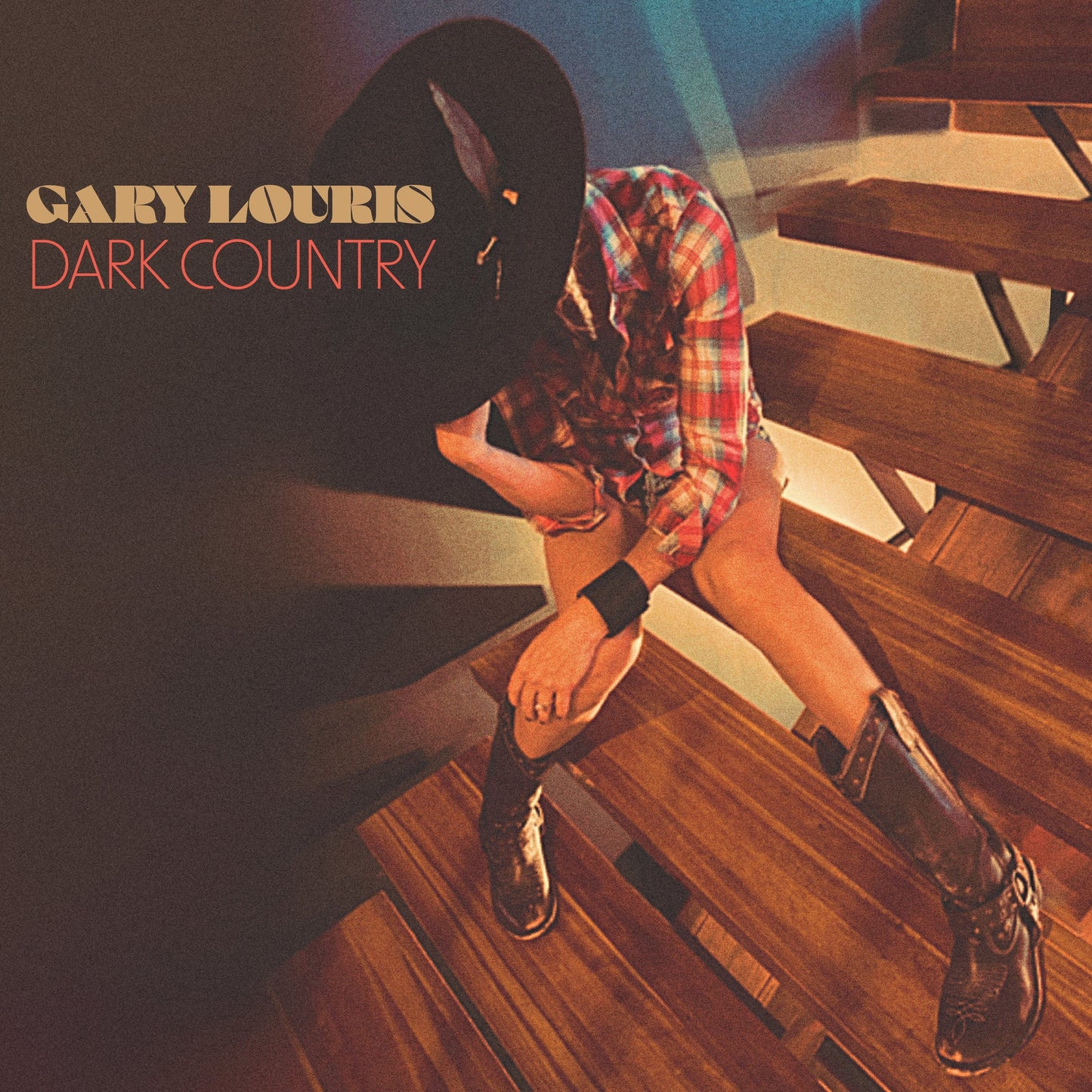 Album cover for Gary Louris’ “Dark Country” featuring a person in western wear.