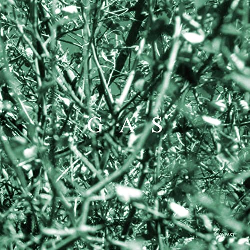Green-tinted close-up of dense, tangled branches with the word GAS in white text.