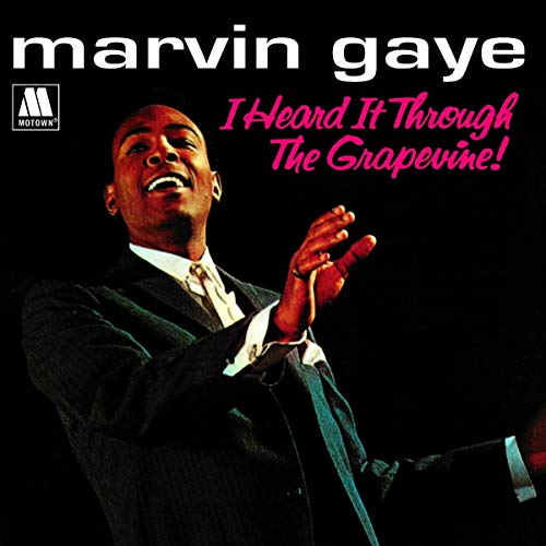 Marvin Gaye album cover, portrait of singer with hands raised.
