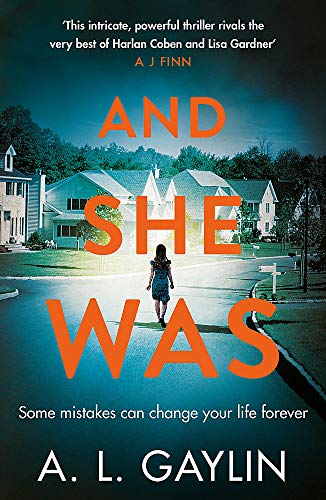 Book cover: woman walking down a suburban street, titled "And She Was".