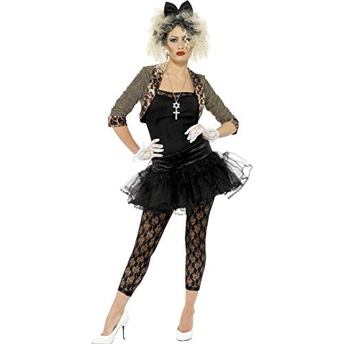 Woman in a black 80s costume, curly blonde wig, and white gloves posing confidently.