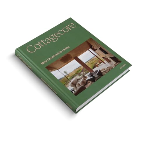 A green hardcover book titled Cottagecore: New Countryside Living with a landscape photo cover.