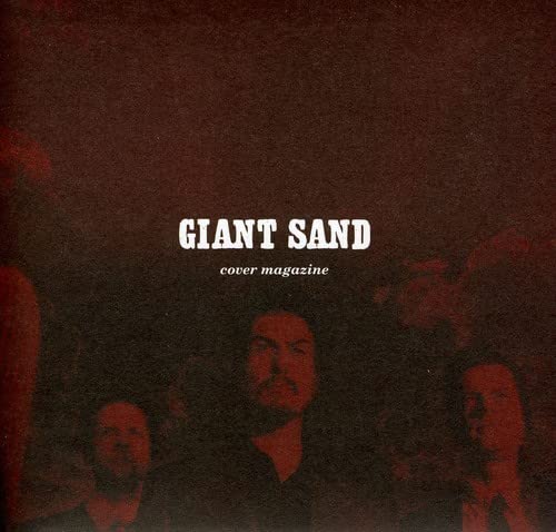 Red-toned album cover with three blurred men’s faces and text: “Giant Sand.”