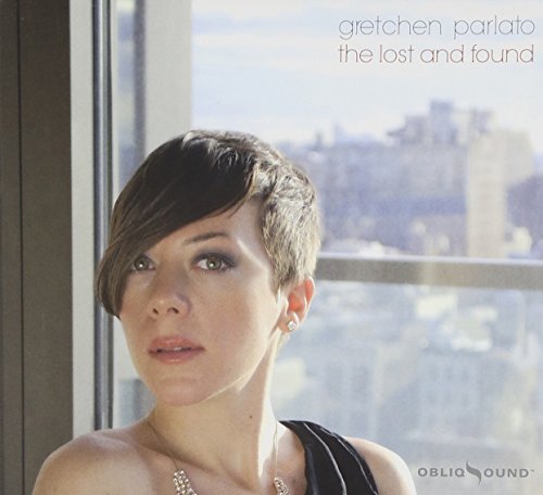Gretchen Parlato album cover featuring a portrait of the artist against a city window.