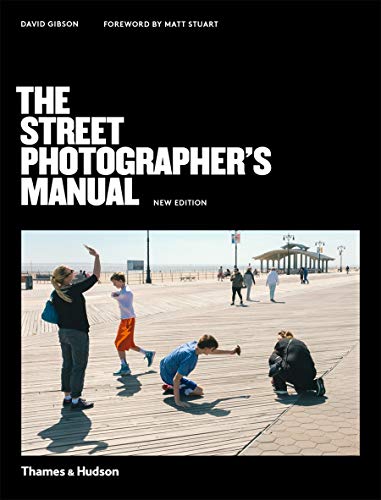 Book cover featuring title text over a photo of people on a wooden boardwalk.