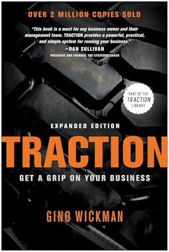 Book cover for "Traction" by Gino Wickman, featuring tire treads.