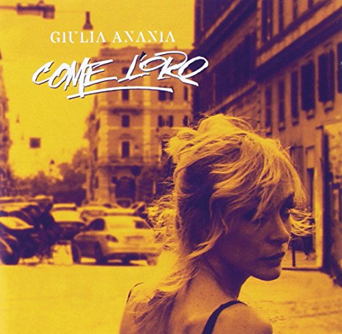 CD cover: woman’s profile with yellow-toned city street background.