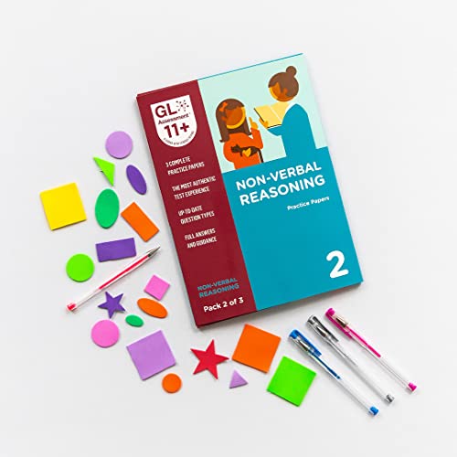 11+ non-verbal reasoning practice papers with colorful geometric shapes and pens.