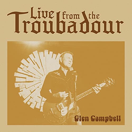 Glen Campbell playing guitar on CD cover, sepia tone, live performance.